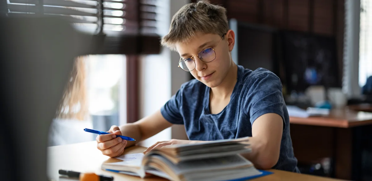 boy studying in the library