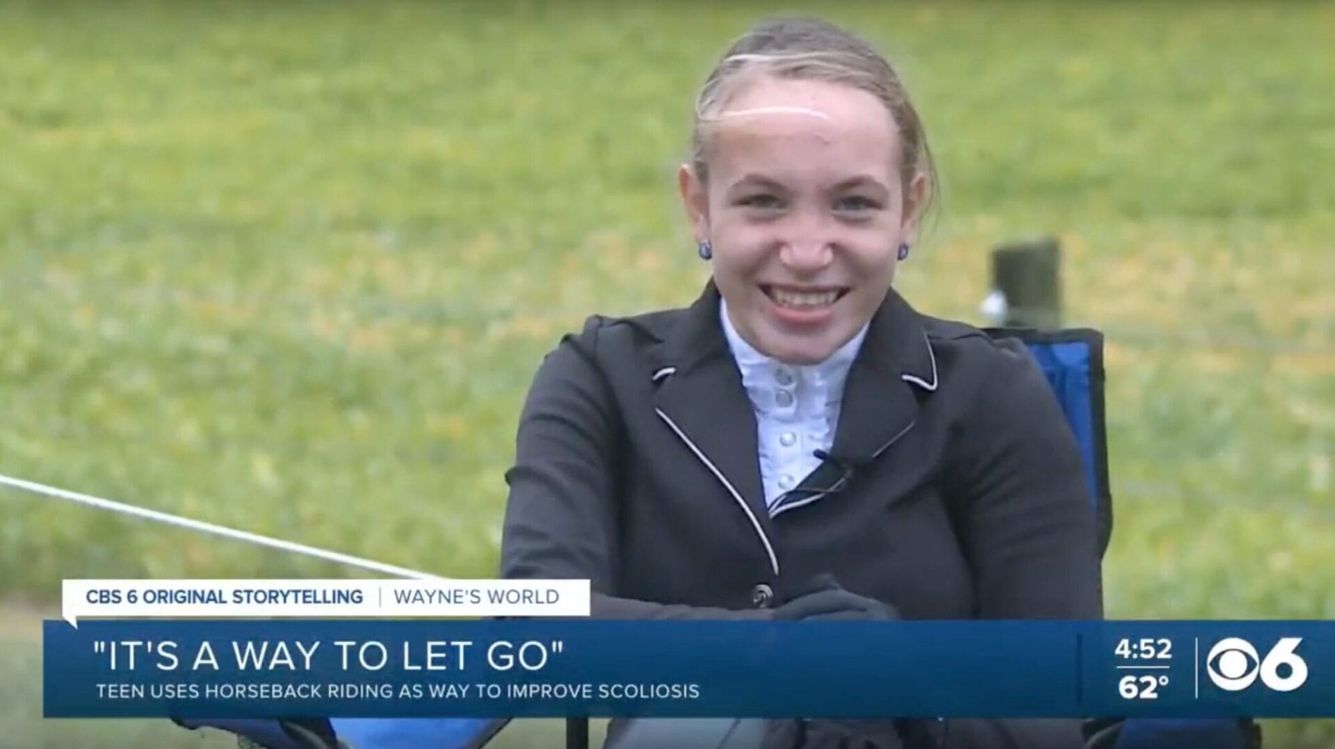 teenager smiling while practicing horseback riding
