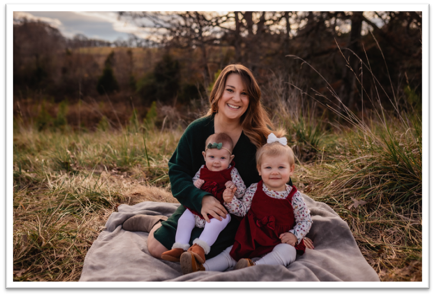Image of Alicia with two smiling children.