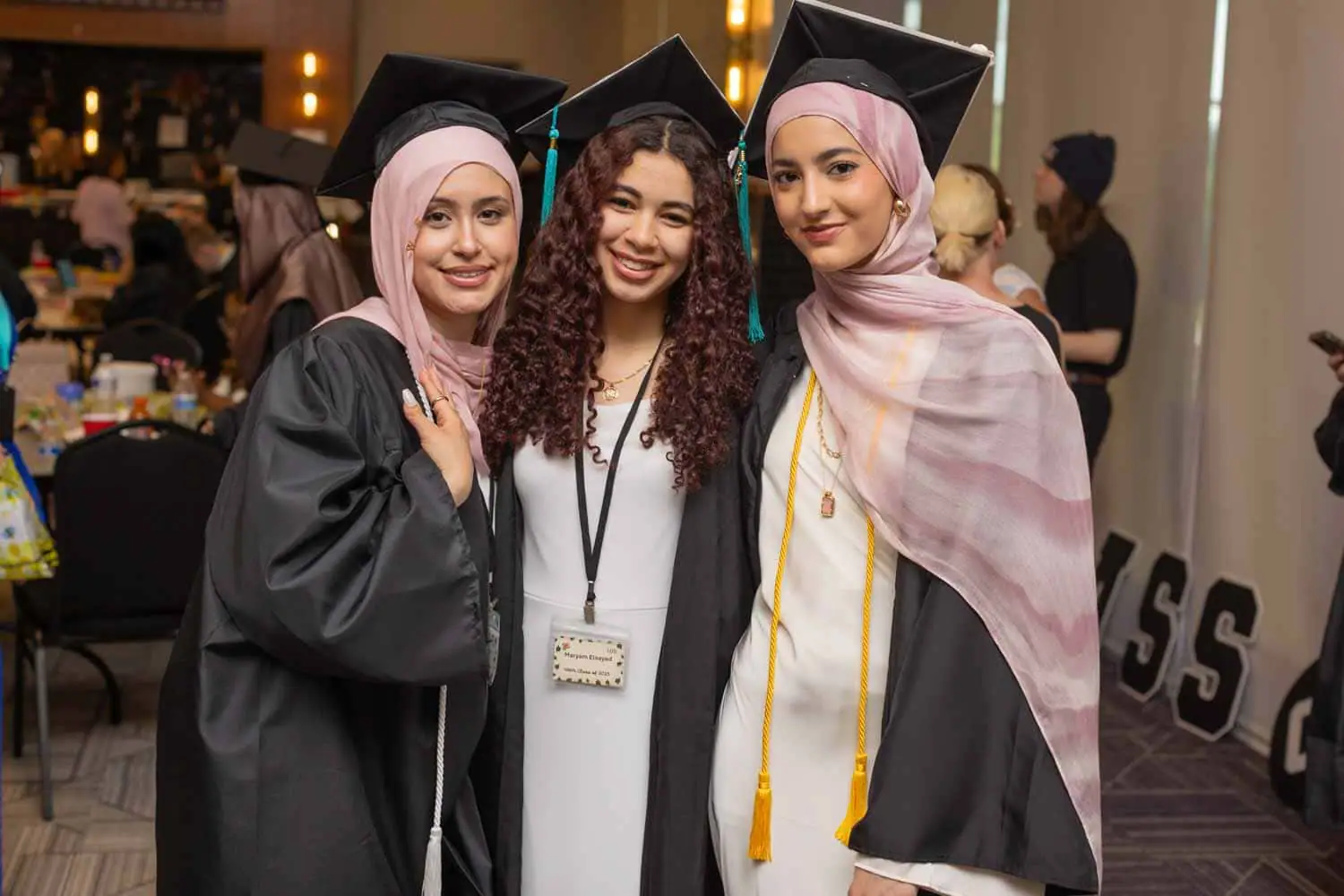 group of students smiling at graduation