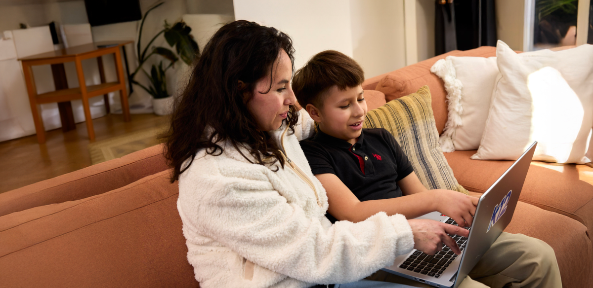 Mom with son looking the computer